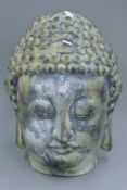 A large Buddha head. 41 cm high.