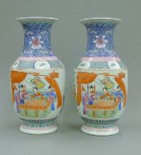 A pair of Chinese porcelain figural vases. 40.5 cm high.