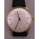 A Garrard 9 ct gold gentleman's wristwatch. 3.5 cm wide.