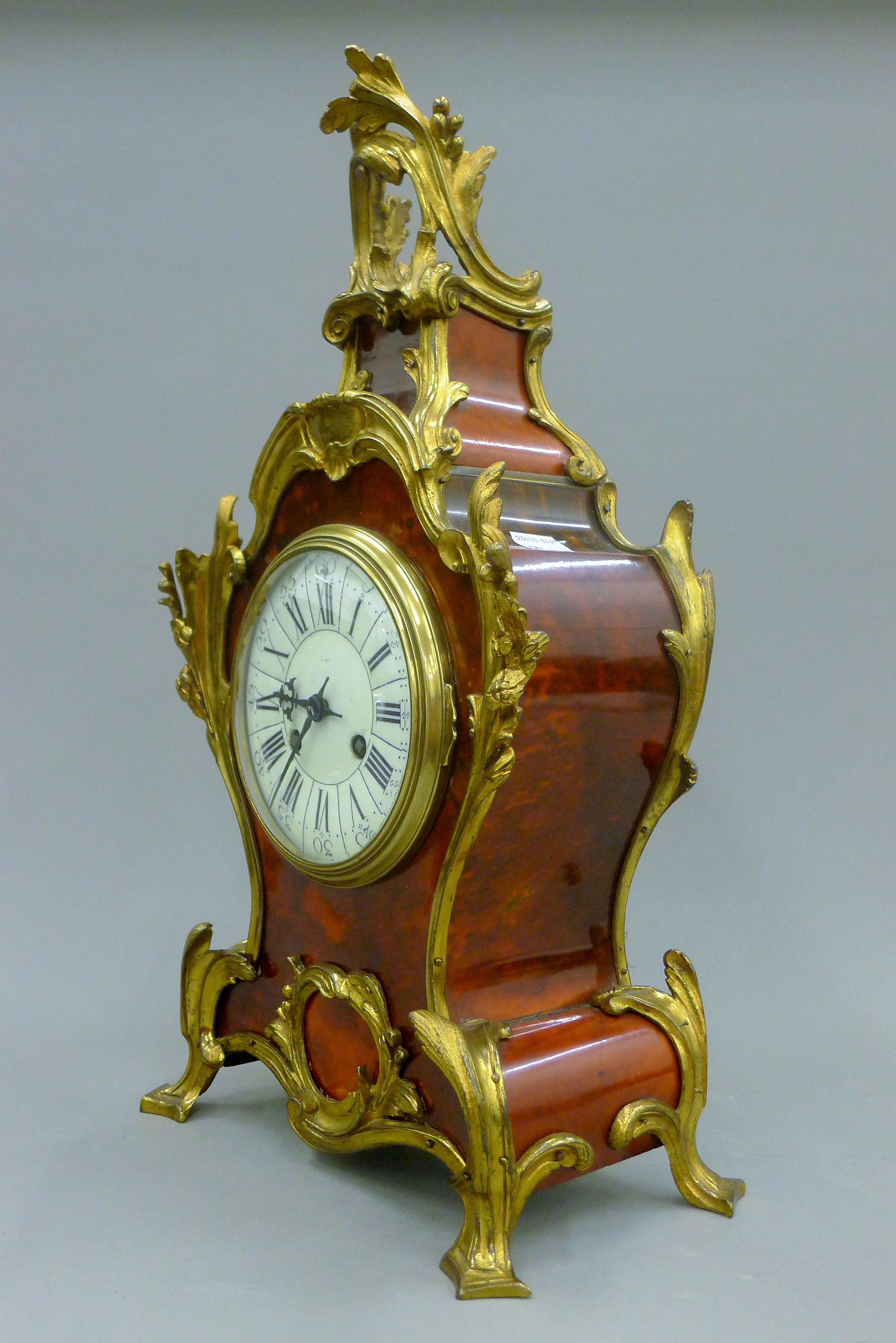 A bronze and tortoiseshell clock. 48 cm high. - Image 2 of 4