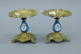 A pair of 19th century Continental ormolu and porcelain tazzas. 15 cm high.