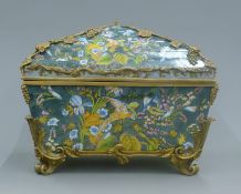 A large bronze and porcelain casket decorated with birds and flowers. 36 cm wide.