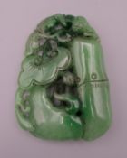 A pierced jade pendant decorated with a bat. 8 cm high.