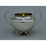 A silver two handled four footed bowl. 19 cm wide. 8.9 troy ounces.