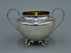 A silver two handled four footed bowl. 19 cm wide. 8.9 troy ounces.