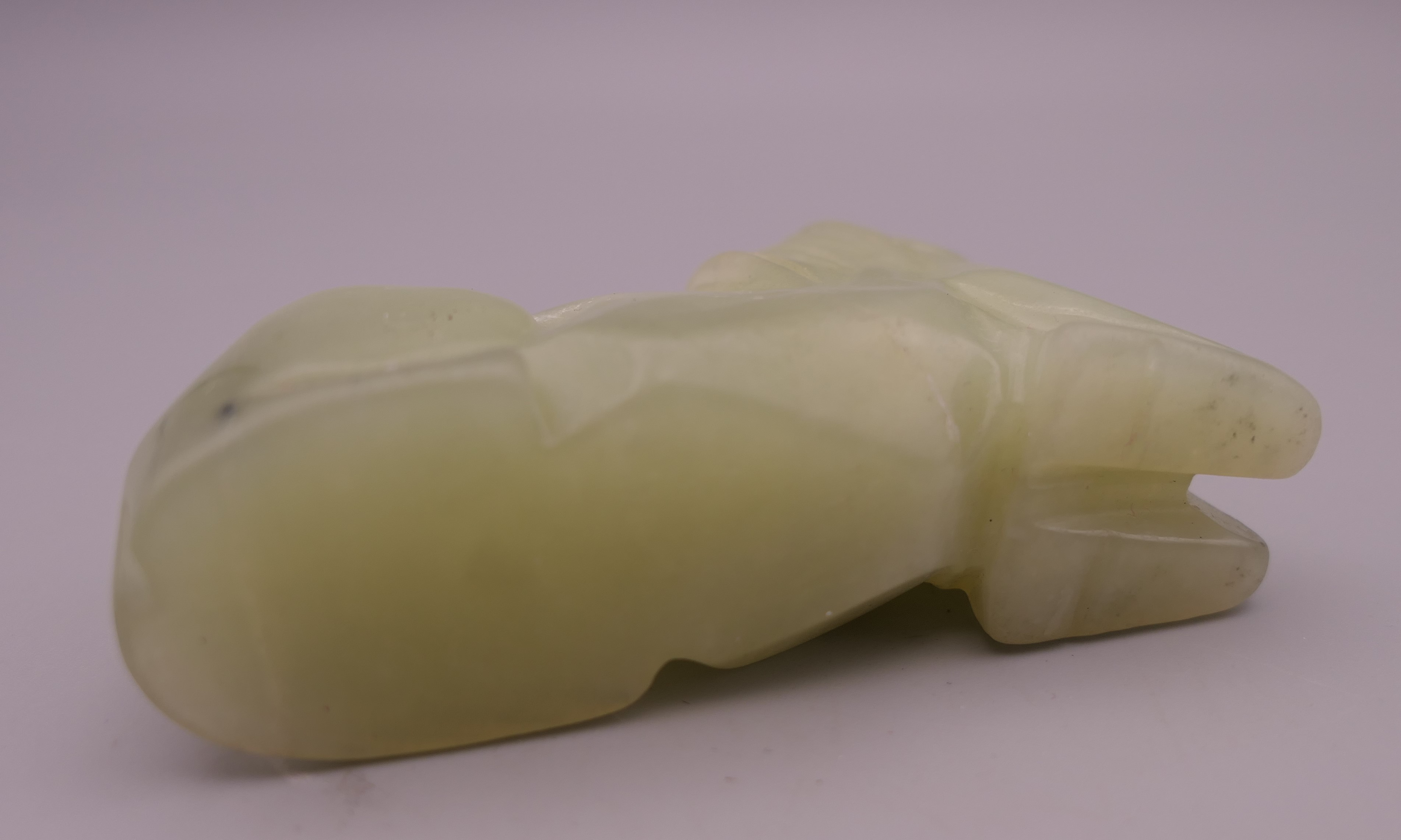 A Chinese pale green jade horse. 7.5 cm long. - Image 3 of 4
