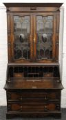 An early 20th century oak bureau bookcase. 110 cm wide x 217 cm high.