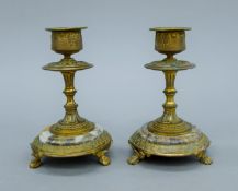 A pair of 19th century ormolu and marble candlesticks. 12 cm high.