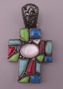 A decorative silver cross form pendant. 6 cm high.