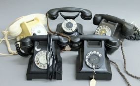 A quantity of vintage telephones.