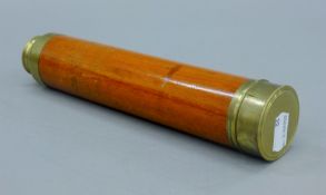 A brass and mahogany three drawer telescope. 74 cm long extended.