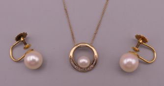 A 9 ct gold and pearl pendant set with small diamonds on a fine 9 ct gold chain and a pair of 9 ct