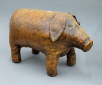A Liberty type leather pig foot stool. 45 cm long.