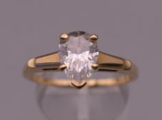 A 14 K gold solitaire ring. Ring size T. 4 grammes total weight.