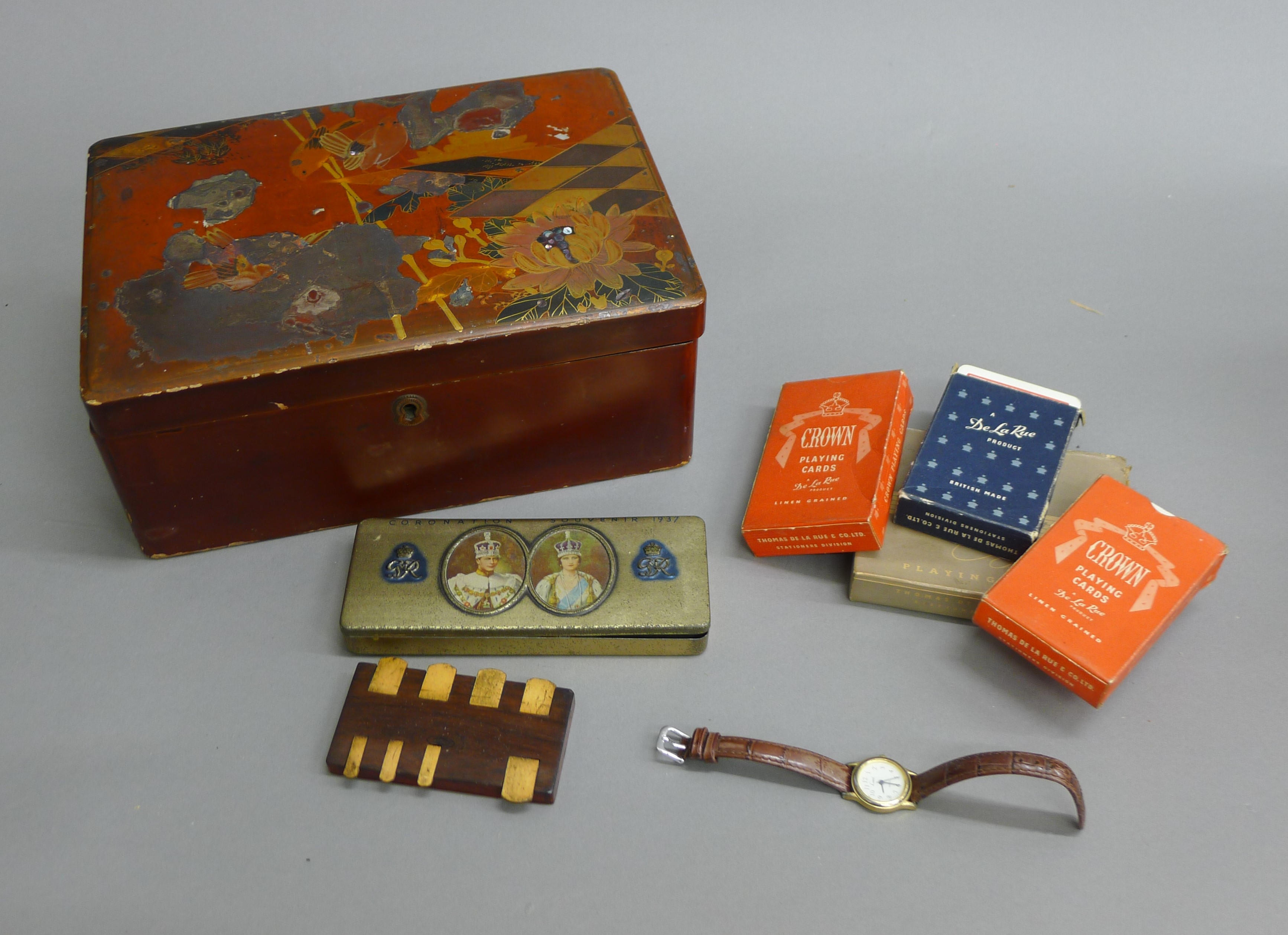 A lacquered box, playing cards, etc.