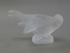 A Lalique bird, signed Lalique France. 7 cm high.