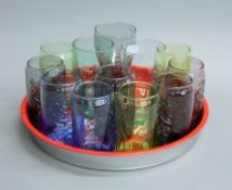 A quantity of Coca-Cola drinking glasses, a tray and three Babycham glasses.