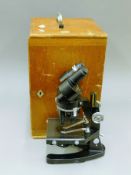 A vintage cased microscope. The case 40 cm high.