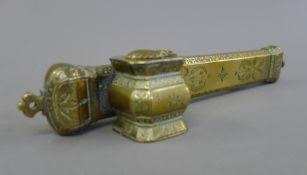 A 19th century Eastern brass scribes box. 24 cm long.