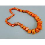 A coral necklace. 51 cm long.