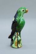 A Chinese porcelain model of a parrot. 19 cm high.