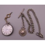 A silver fob watch on chain.