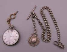 A silver fob watch on chain.