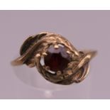 A 9 ct gold garnet set ring. Ring size P/Q. 1.9 grammes total weight.