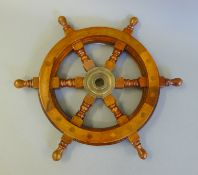 A small wooden ships wheel. 31.5 cm diameter.