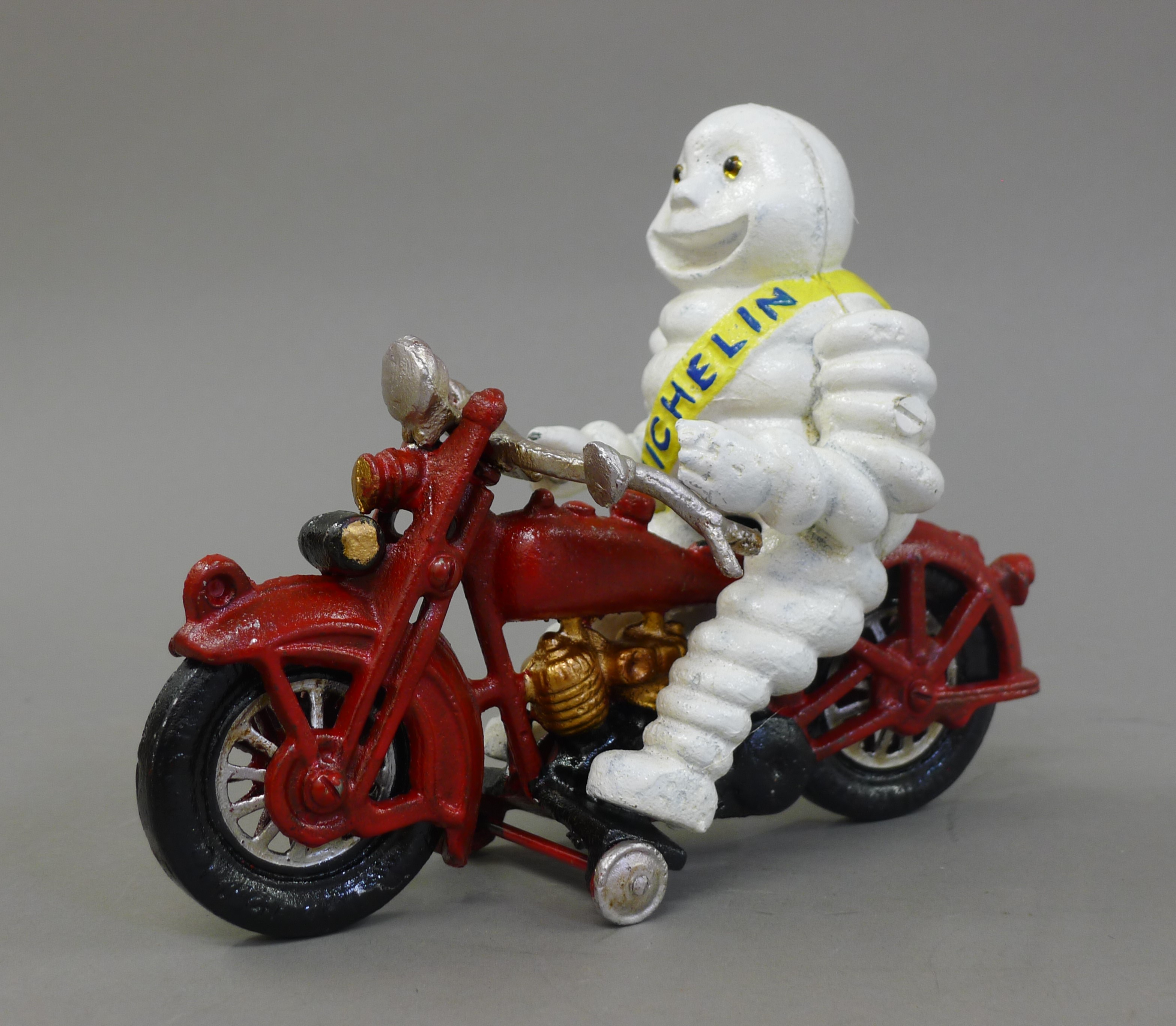 A cast iron model of a Michelin man on a motorcycle. 22 cm long. - Image 2 of 2