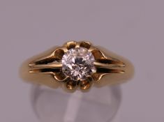 A gentleman's 18 ct gold diamond ring. Ring size S. 7.4 grammes total weight. Approximately 0.7/0.