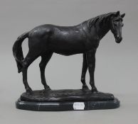 A bronze model of a horse. 26 cm long.