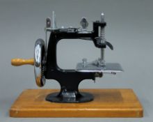 A small vintage boxed sewing machine.