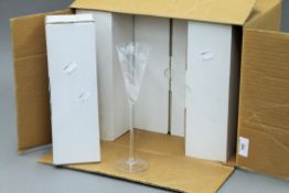 A set of boxed champagne flutes.