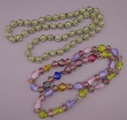 Two strings of Venetian beads.