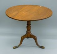 A 19th century mahogany tilt top tripod table. 86.5 cm diameter.