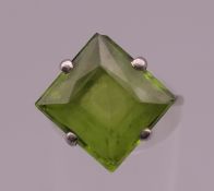 An unmarked green stone, possibly peridot ring. Ring size K. 4.2 grammes total weight.