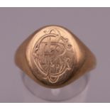 An unmarked 9 ct gold signet ring. Ring size R. 6.8 grammes.