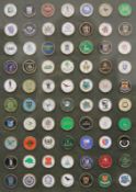 A collection of golf badges.