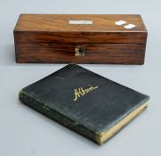 A Victorian rosewood sewing box and a sketch album.