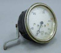 A Smiths patent classic car speedometer. 9 cm diameter.