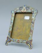 A 19th century brass and champleve enamel photograph frame. 22 cm high.