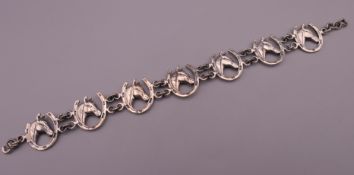 A silver Lucky Horseshoe bracelet. 16 cm long.