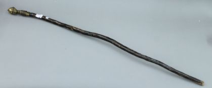 An antique bronze handled African walking staff. 117 cm long.