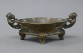 A Chinese bronze censer with dog-of-fo handles. 19.5 cm wide.