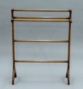 A Victorian Arts and Crafts towel rail with original painted decoration. 70.5 cm wide.