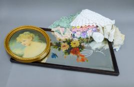 A Victorian painted mirror, a print of a young girl and a quantity of crochet table mats.