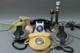 A quantity of vintage telephones.