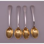 Four Georgian silver gilt teaspoons. 63 grammes.
