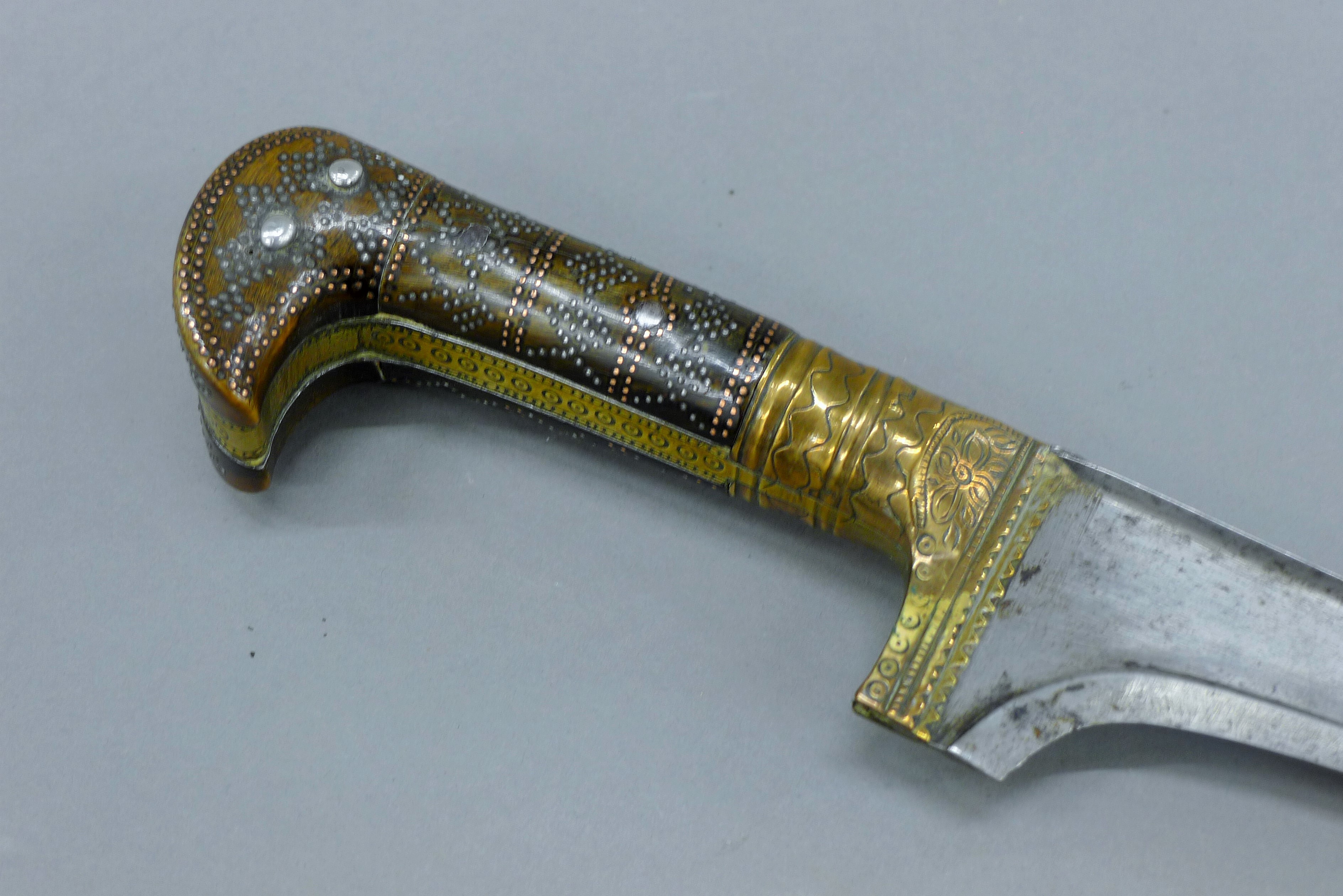 A finely worked Khyber dagger and pique horn grip, curved edge blade, - Image 4 of 17